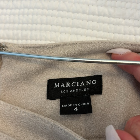 Marciano shorts in a size 4 good condition beige a little mark on the buckle - Picture 3 of 4